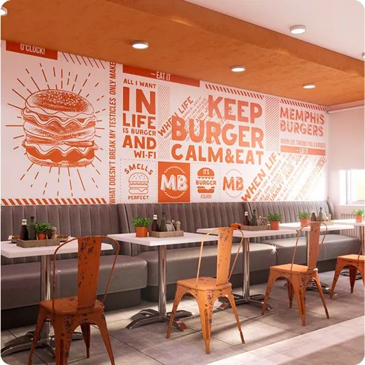 Diseño de vinilo con frase Keep Burger Calm & Eat en pared de restaurante con ambiente moderno